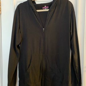 Drain holding black hoodie by pink pepper